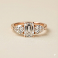 The Rose Gold Emerald & Pear Diamond Three-Stone Ring