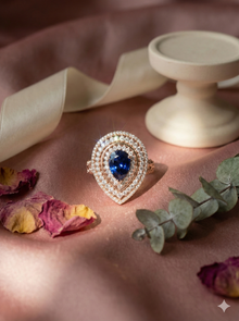 The Royal Blue Sapphire Pear Double Halo Ring