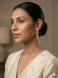 he Swirling Elegance Two-Tone Diamond Drop Earrings